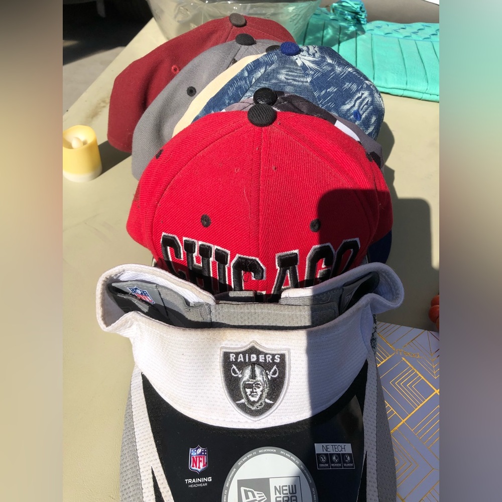 different style hats, mainly flat bills, one visor
